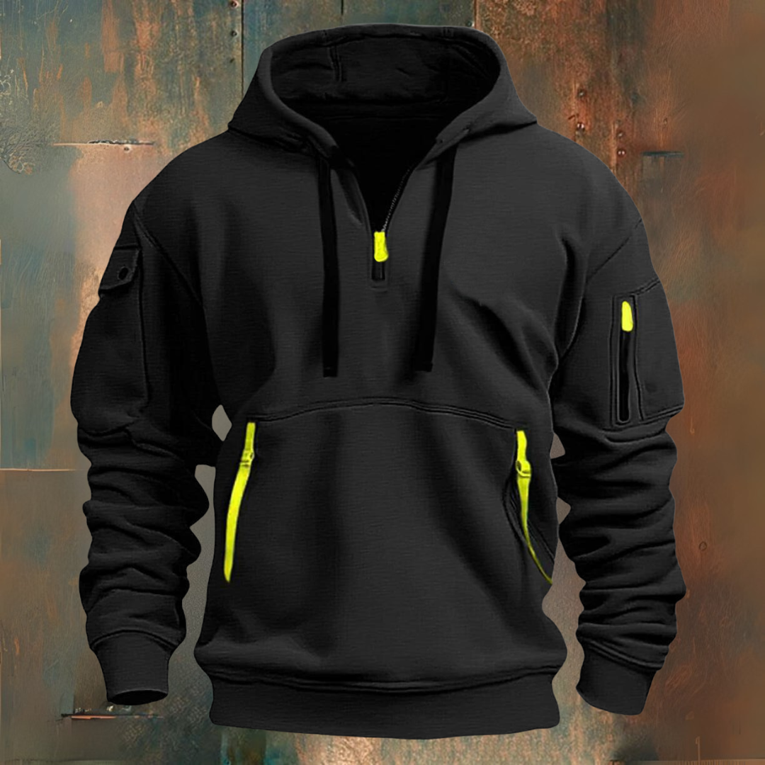 Black hoodie with yellow zippers on a textured background