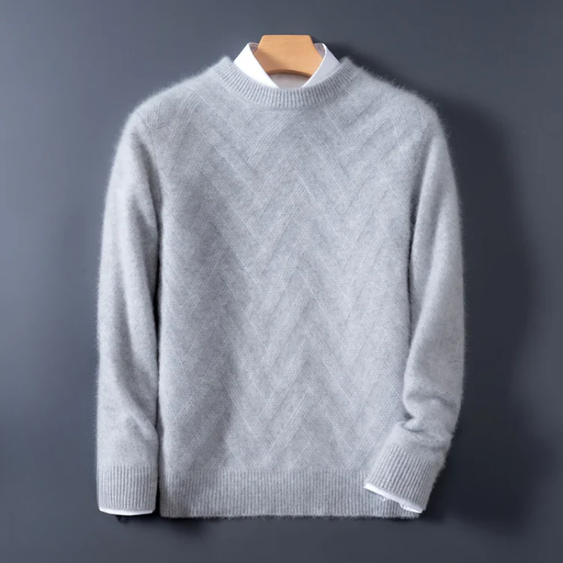 Gray sweater on a hanger against a dark background