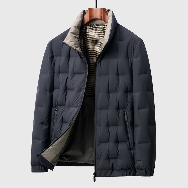 Dark blue puffer jacket on a hanger against a light gray background