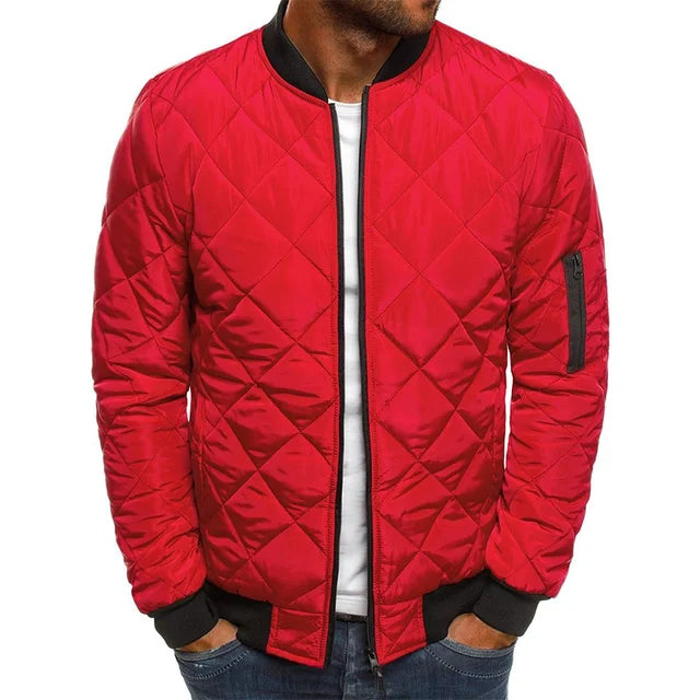 Red quilted jacket worn by a person on a white background
