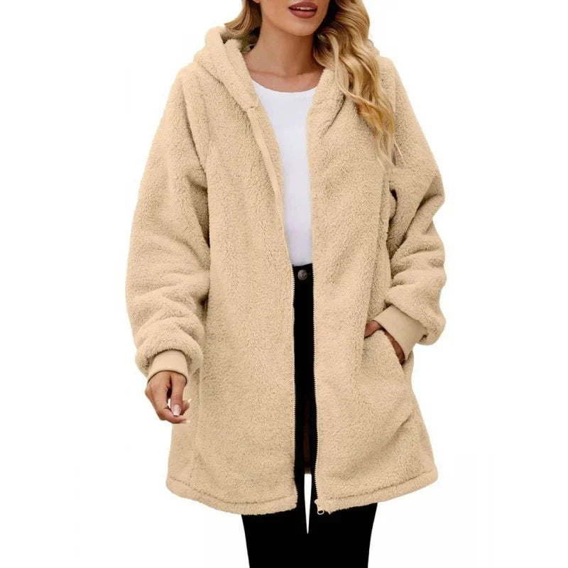 Beige fleece jacket worn by a person on a white background