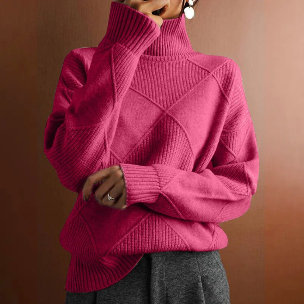 Person wearing a pink turtleneck sweater with dark pants