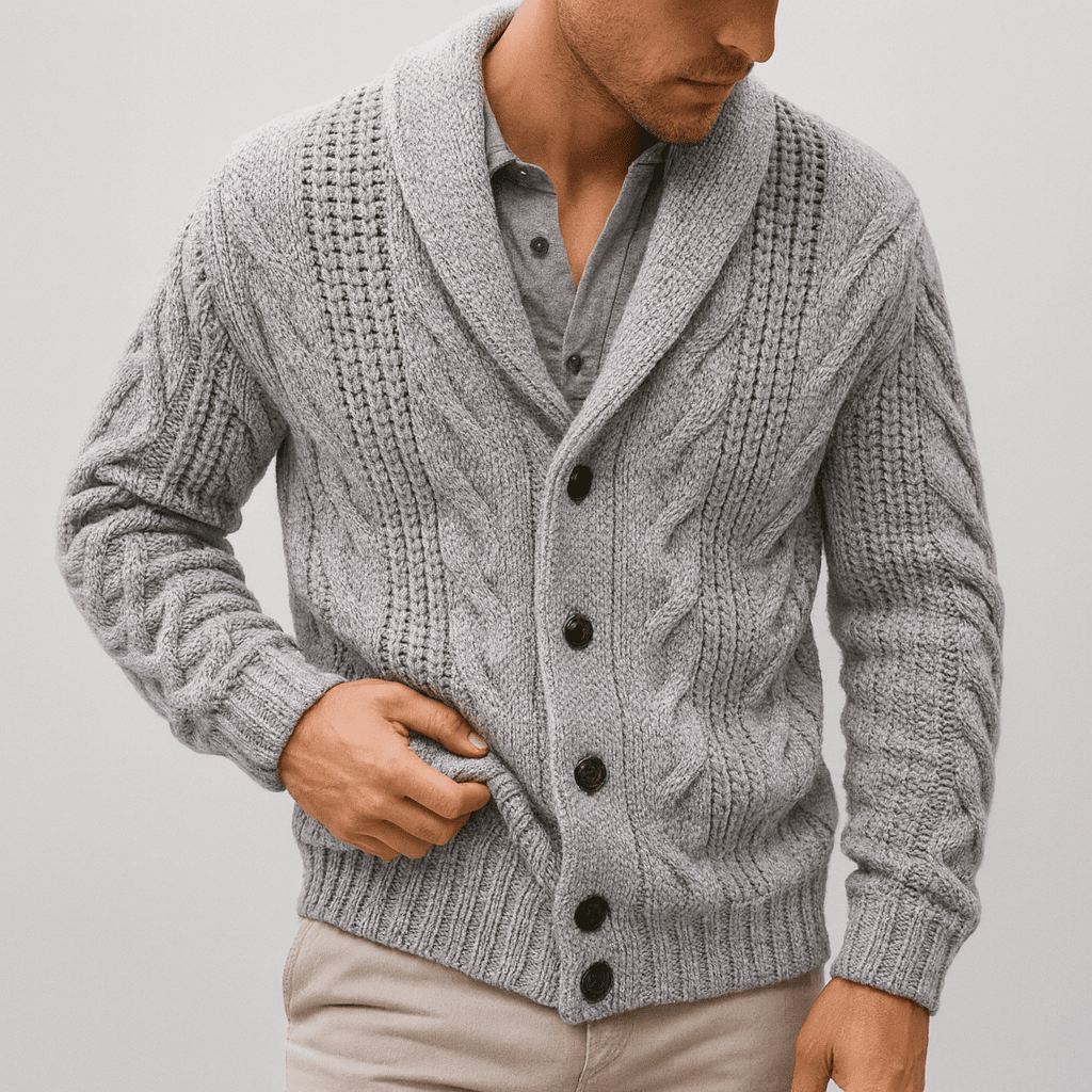Man wearing a gray knitted cardigan with button details on a plain background