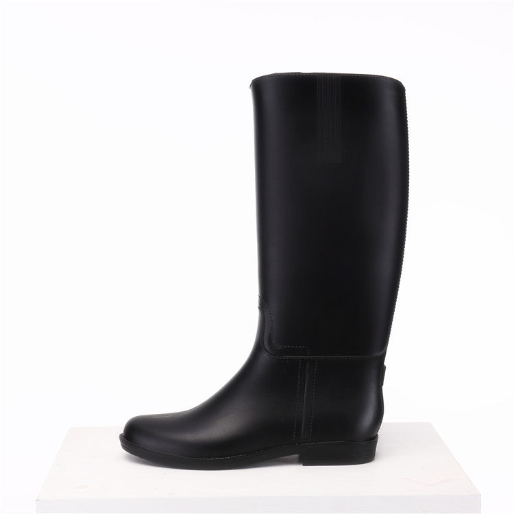 Black rubber boot on a white background