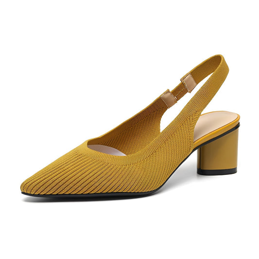 Yellow heeled shoe on a white background