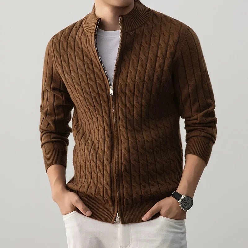 Brown cable knit sweater with a person wearing it on a light gray background