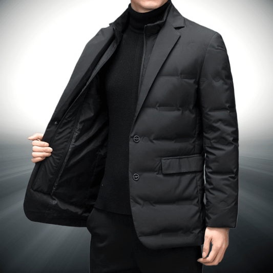 Black puffer jacket worn by a person on a gray background