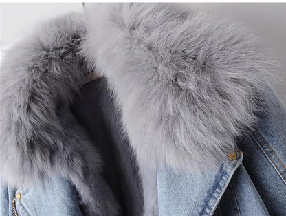 Denim jacket with gray fur collar on a neutral background