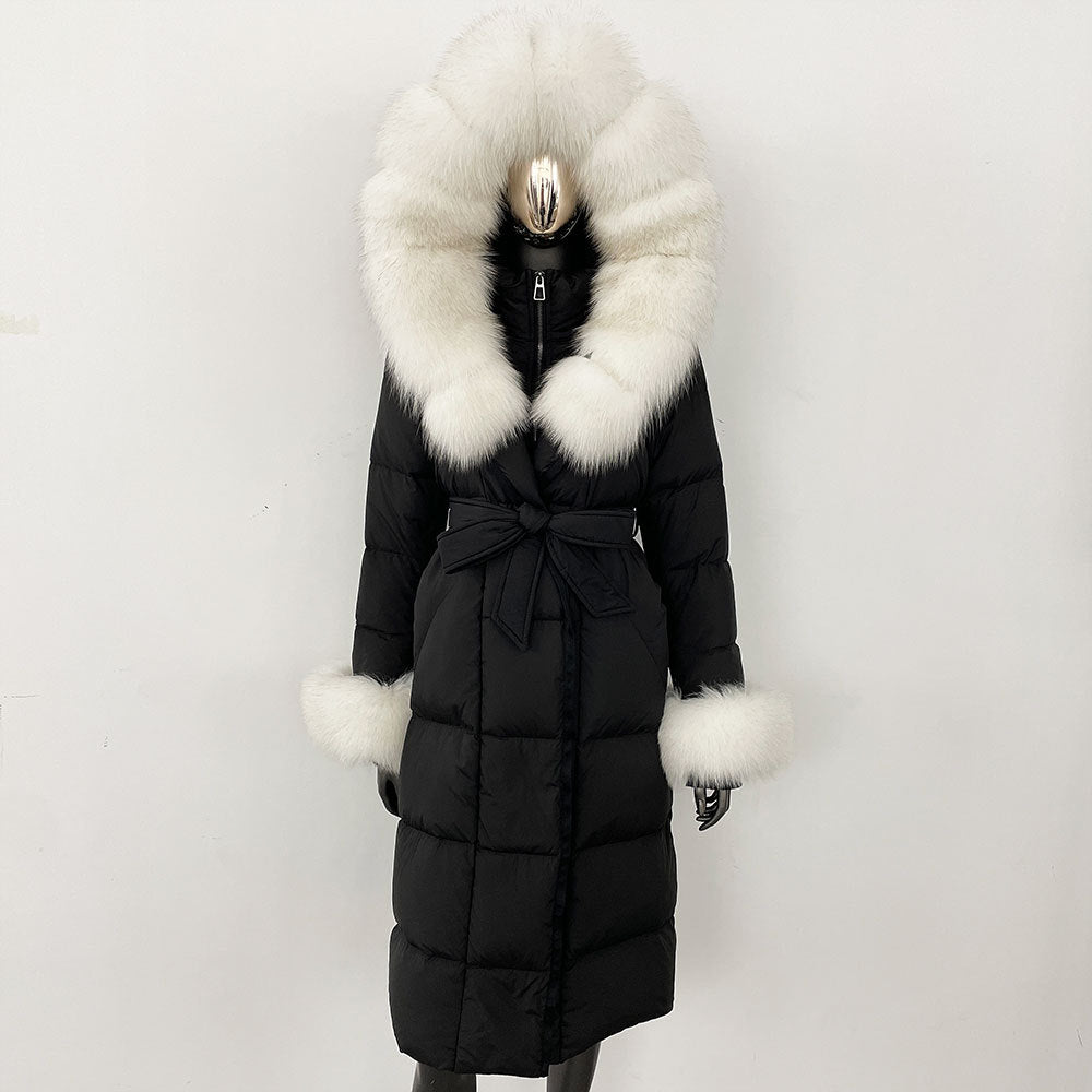 Black puffer coat with large fur hood and cuffs on a white background
