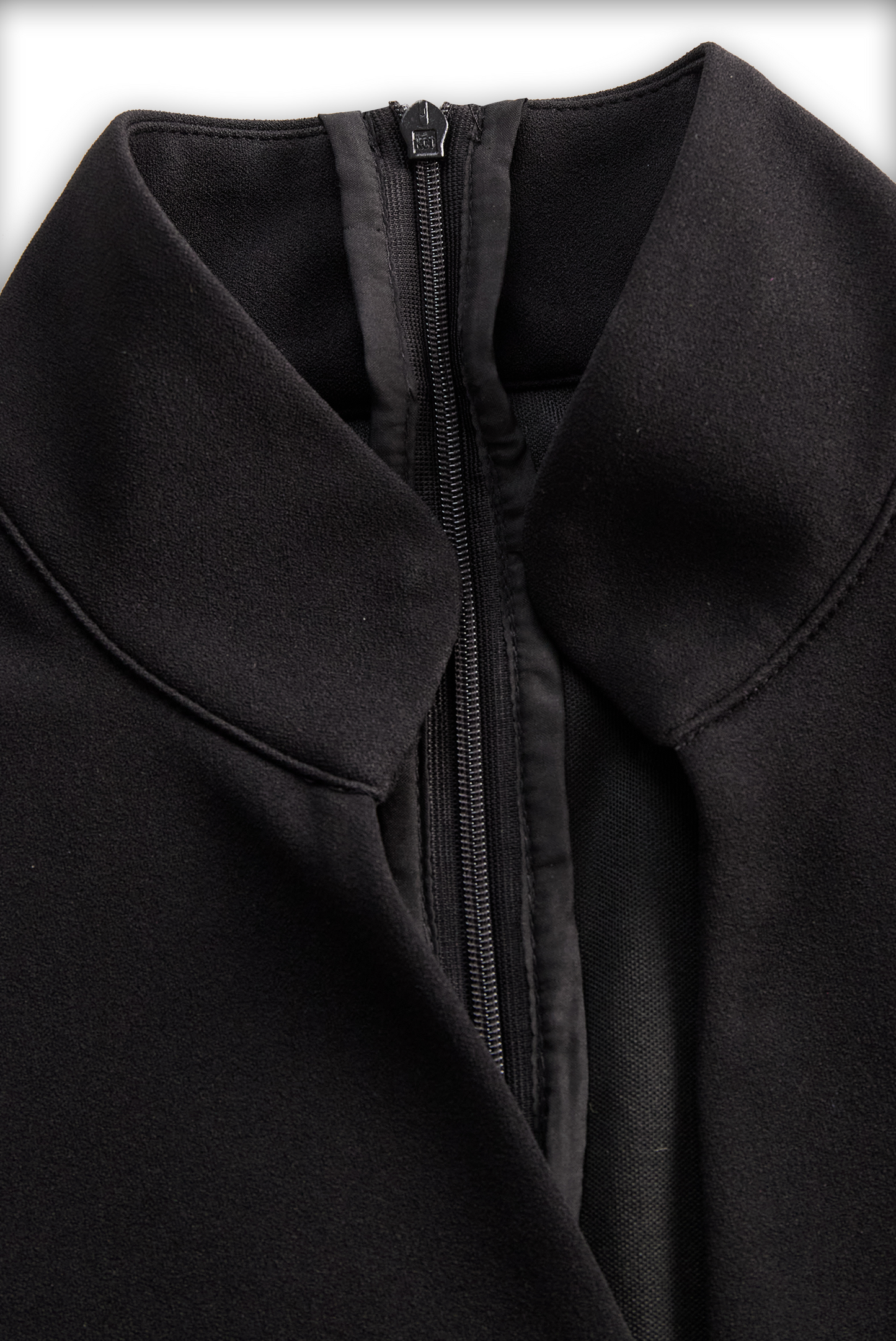 Close-up of a black coat with a zipper