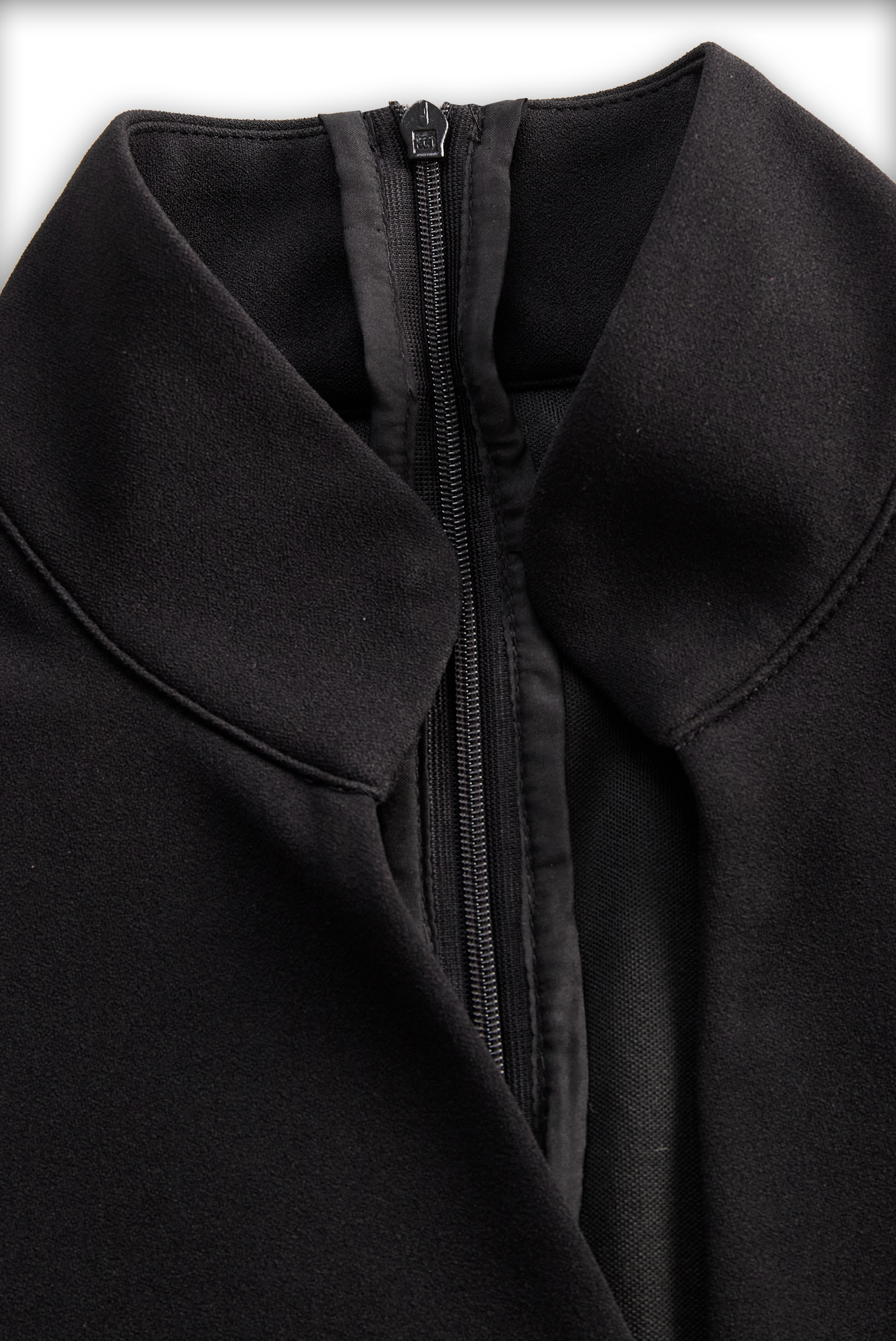 Close-up of a black coat with a zipper