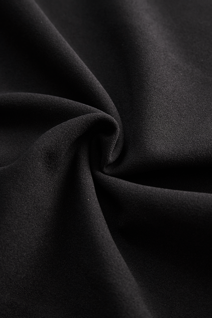 Close-up of black fabric with folds