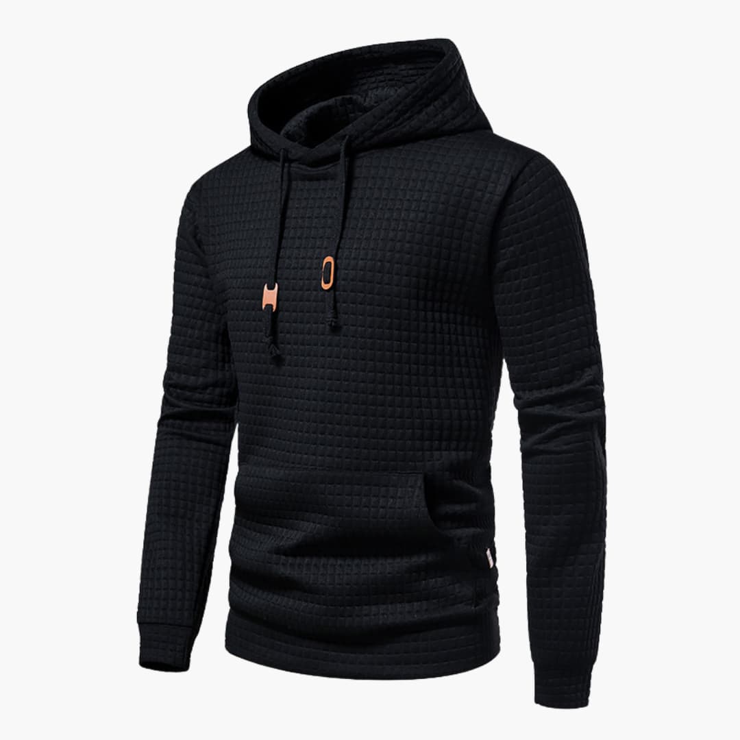 Black textured hoodie with a small orange logo on a white background