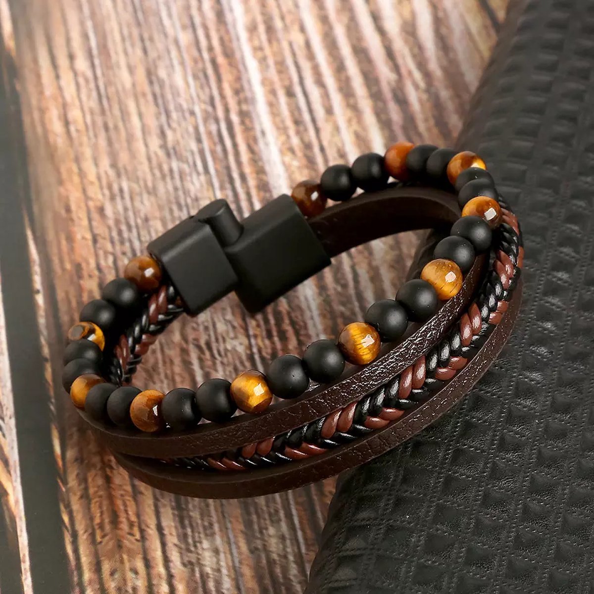 Multistrand leather and beaded bracelet on a wooden surface