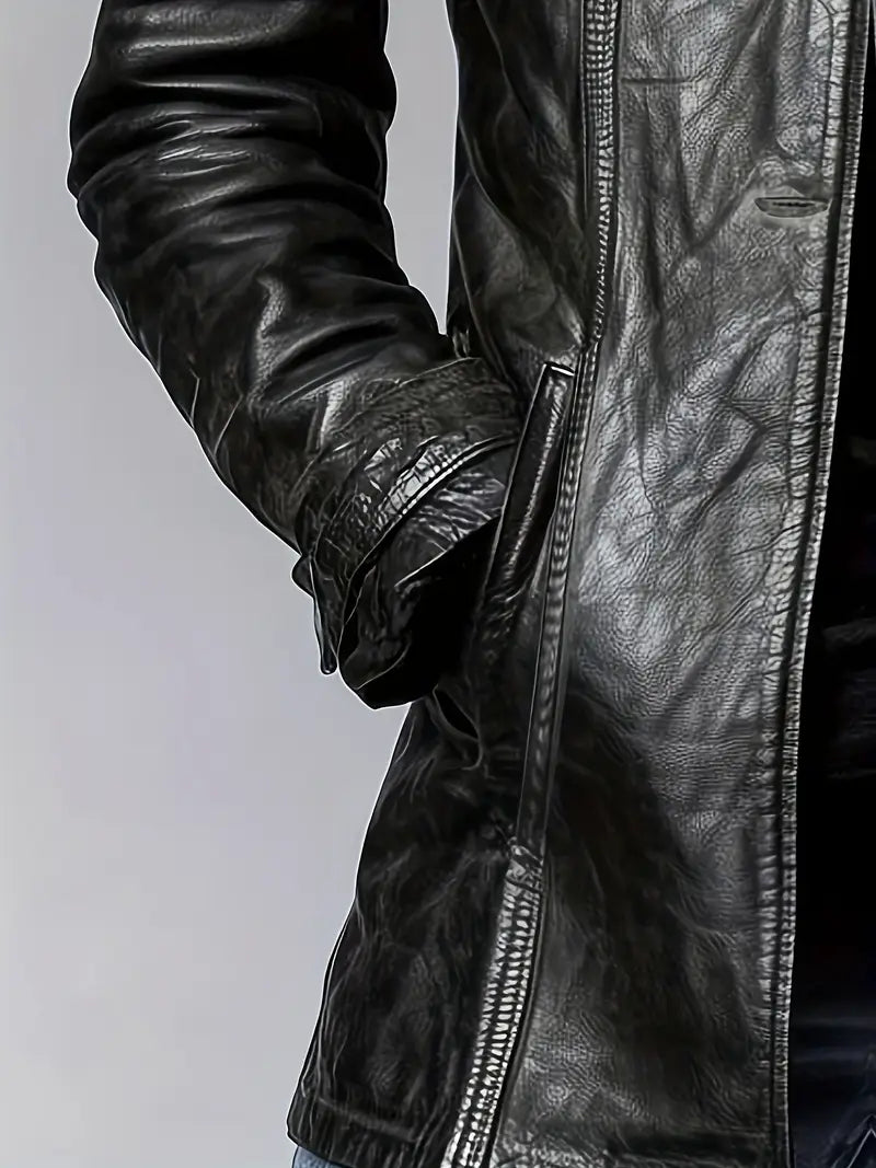 Close-up of a black leather jacket with a zipper on a light gray background