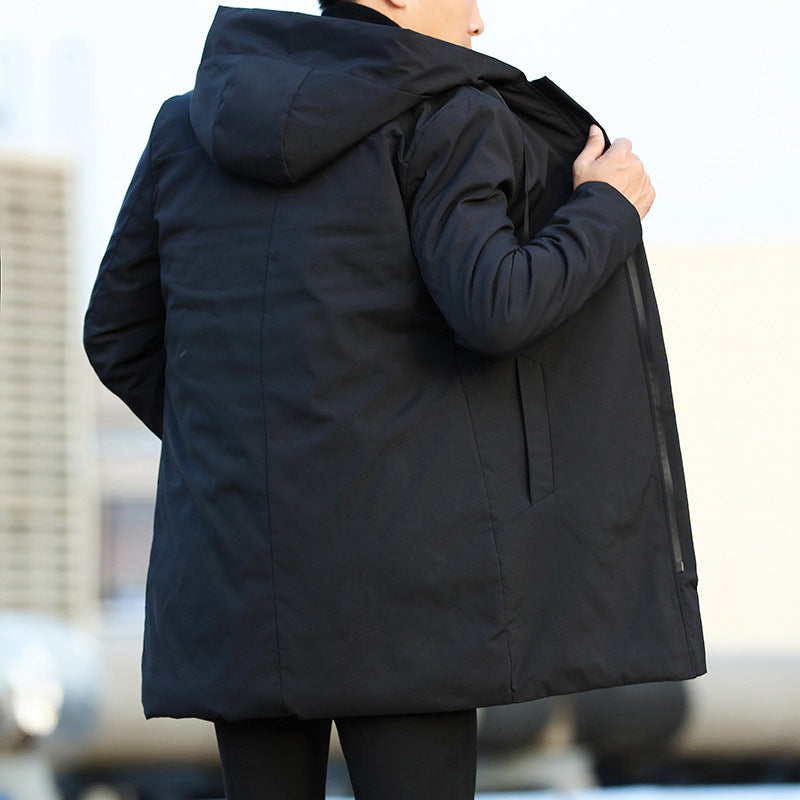 Person wearing a black coat with a blurred background