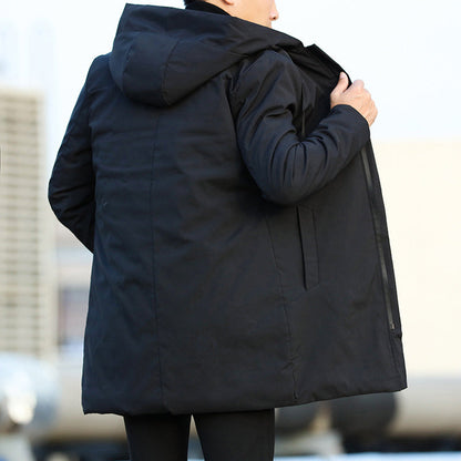 Person wearing a black coat with a blurred background