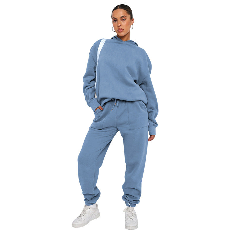 Woman wearing a blue tracksuit on a white background