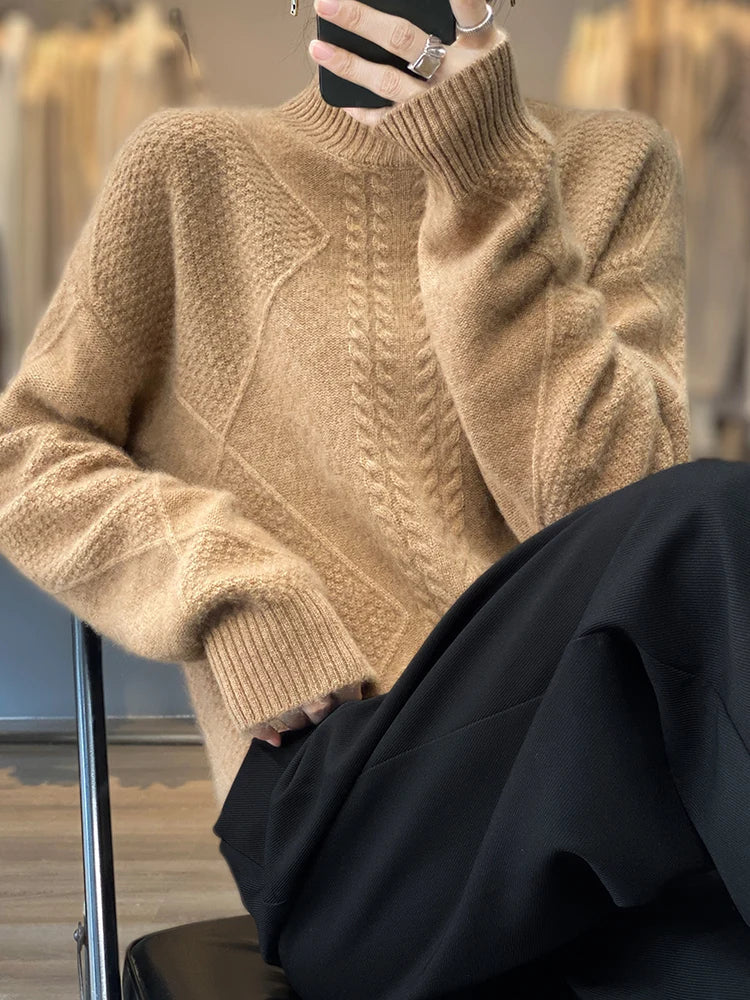 Person wearing a beige knitted sweater in an indoor setting