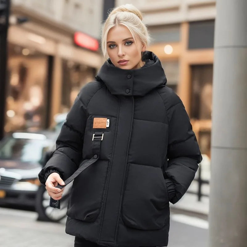 Woman wearing a black puffer jacket on a city street