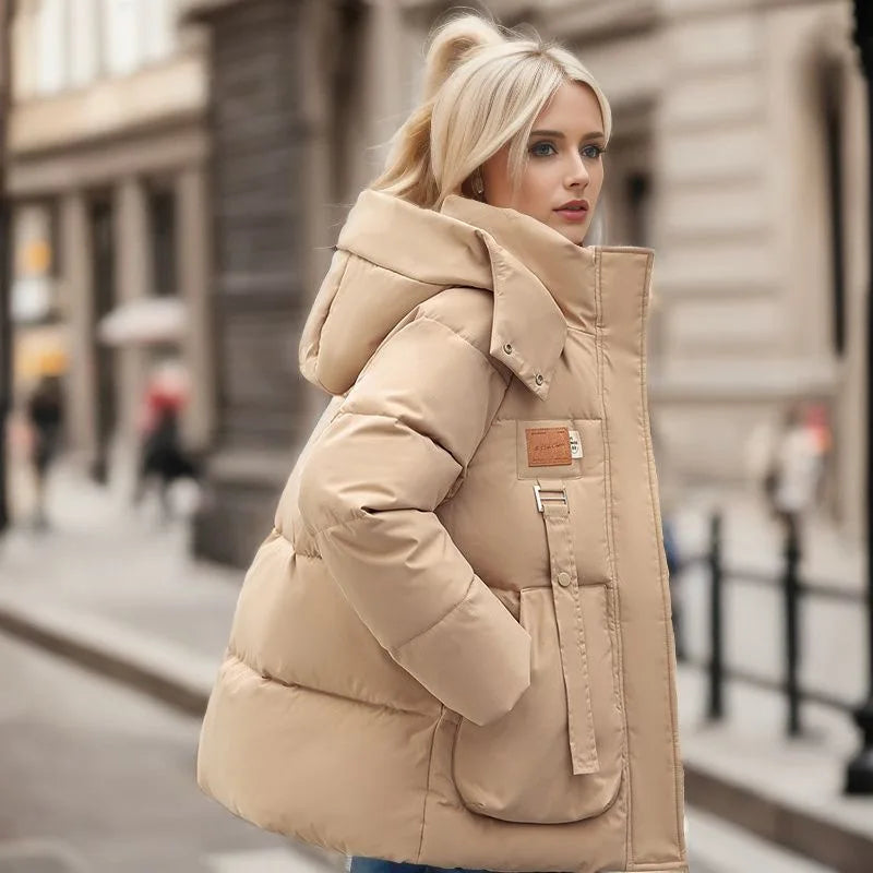 Woman wearing a beige puffer jacket on a city street