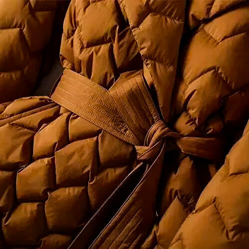 Close-up of a brown puffer jacket with a belt