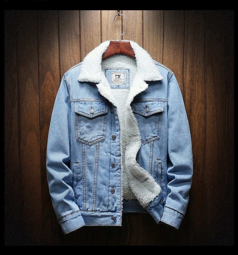 Blue denim jacket with white fur lining on a wooden hanger against a wooden background