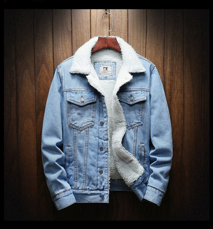 Blue denim jacket with white fur lining on a wooden hanger against a wooden background
