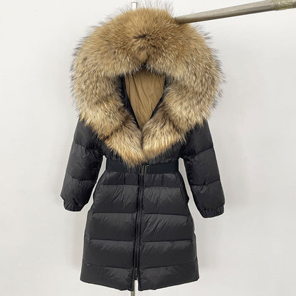 Black puffer coat with a large fur hood on a white background