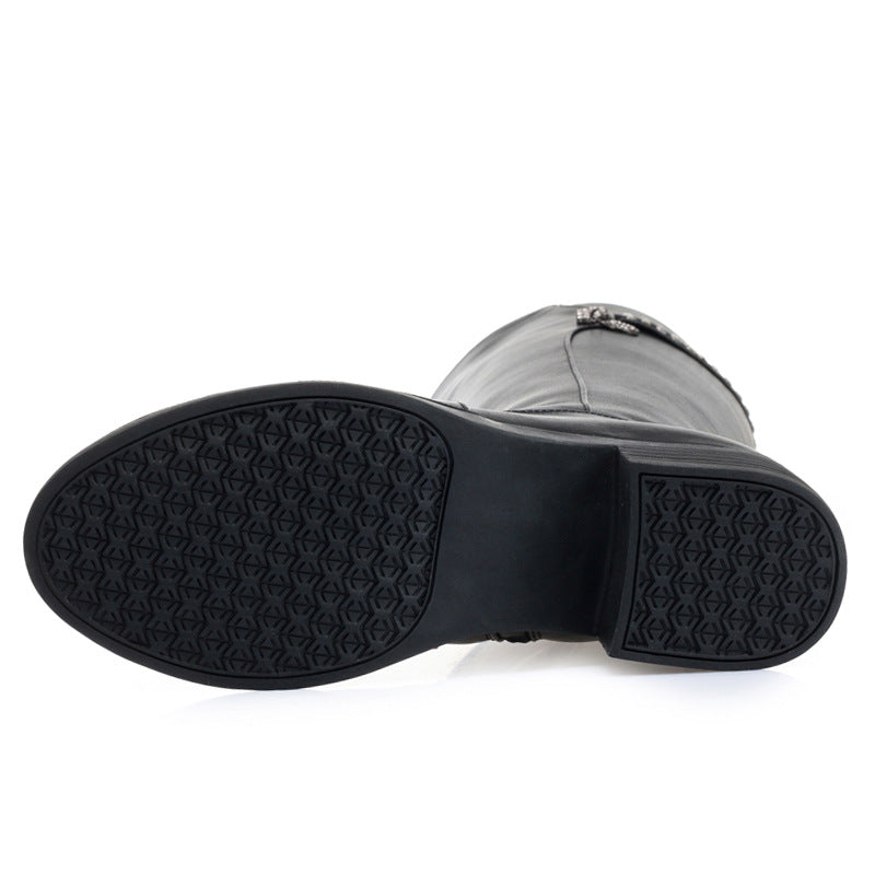 Close-up of a black rubber sole on a white background