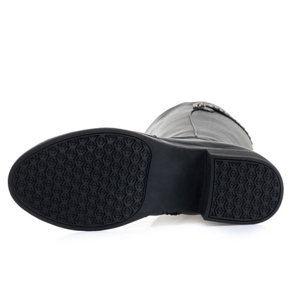 Close-up of a black rubber sole on a white background