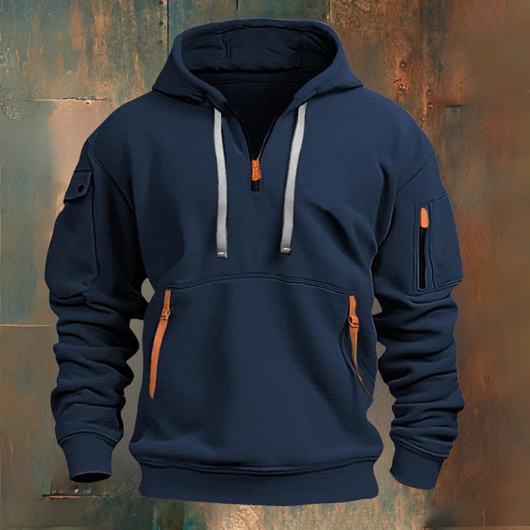 Navy blue hoodie with orange accents on a textured brown background