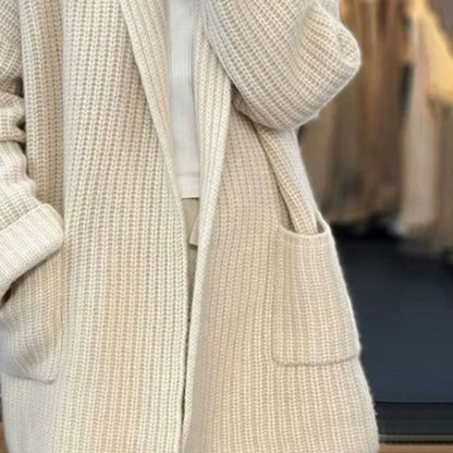 Beige knitted cardigan with a blurred background