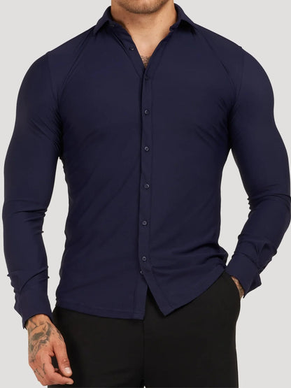 Navy blue button-up shirt worn by a person on a gray background