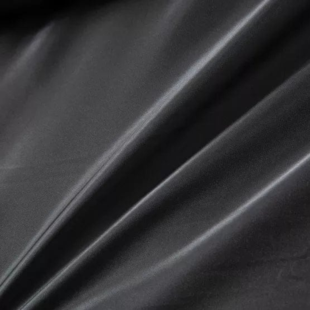 Close-up of dark gray fabric with folds
