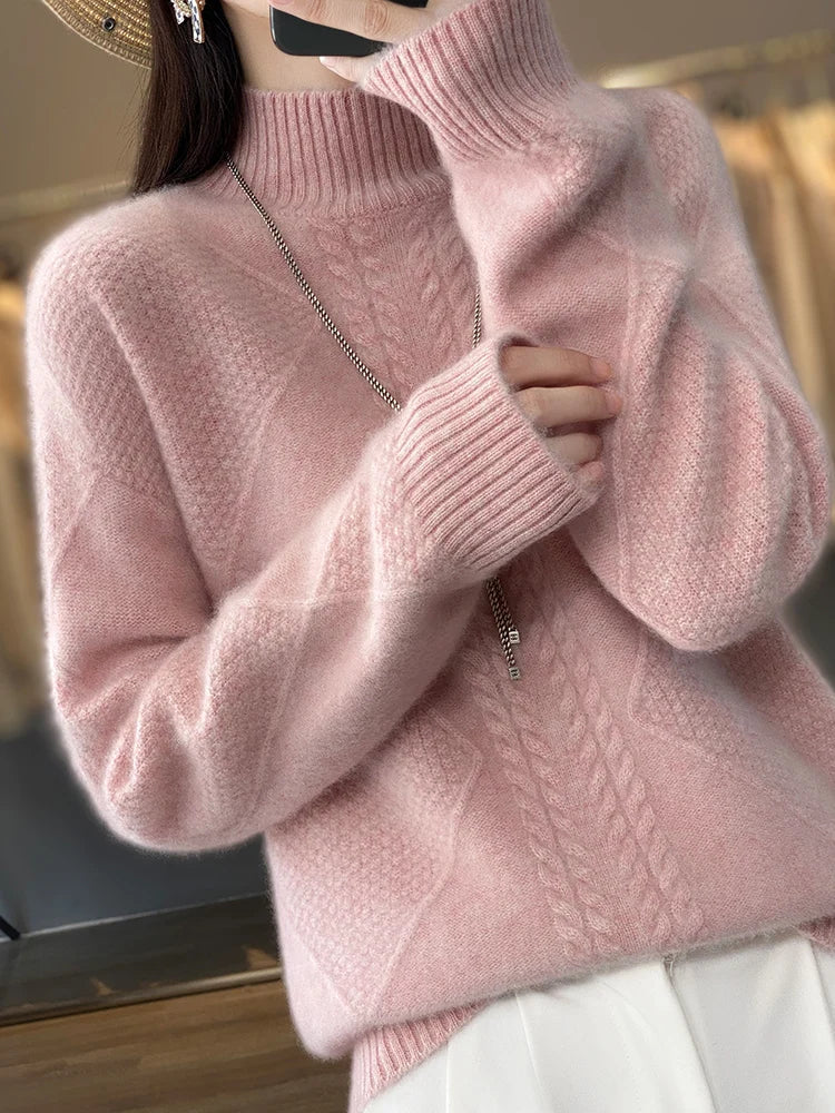Person wearing a pink knitted sweater with a blurred background