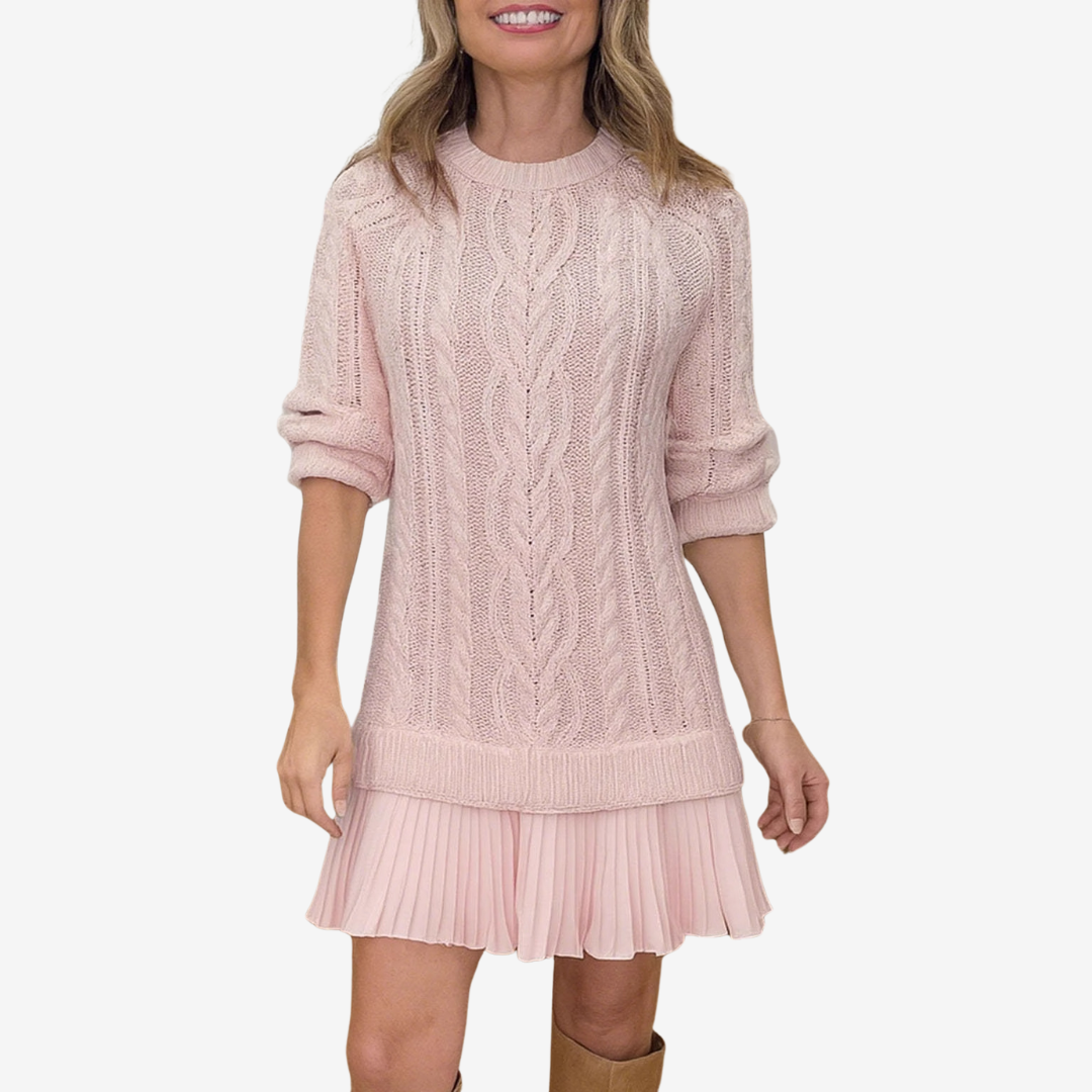 Woman wearing a pink cable knit dress on a white background