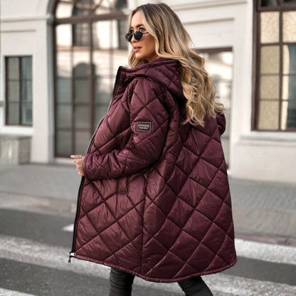 Woman wearing a quilted purple coat in an urban setting