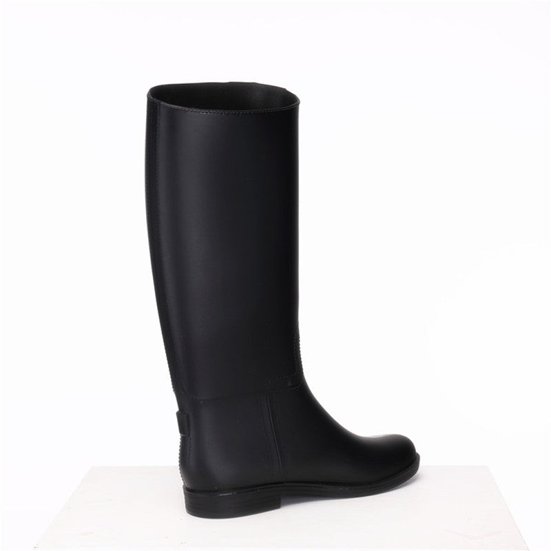 Black knee-high boot on a white background