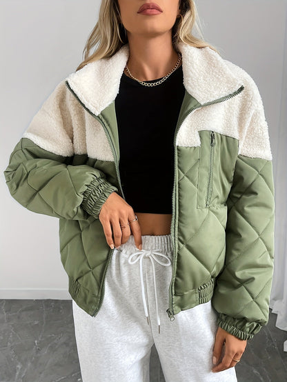 Person wearing a green and white jacket with a plain background