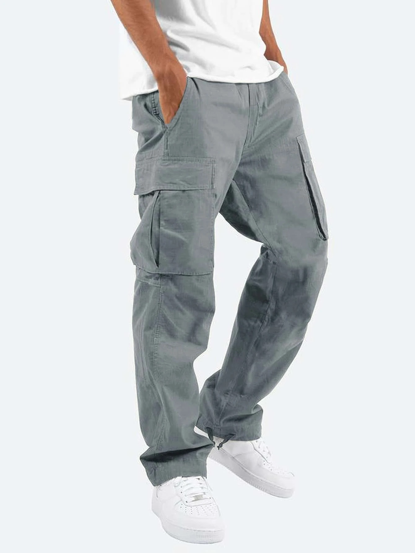 Gray cargo pants worn by a person on a white background