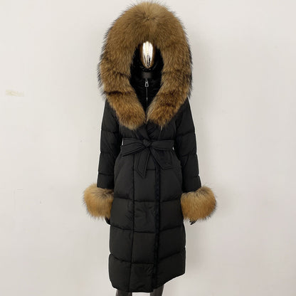 Black puffer coat with brown fur hood and cuffs on a white background