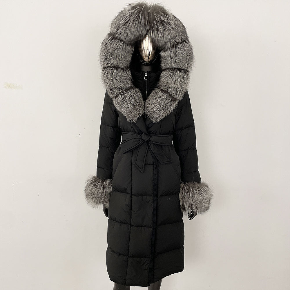 Black winter coat with fur hood and cuffs on a white background