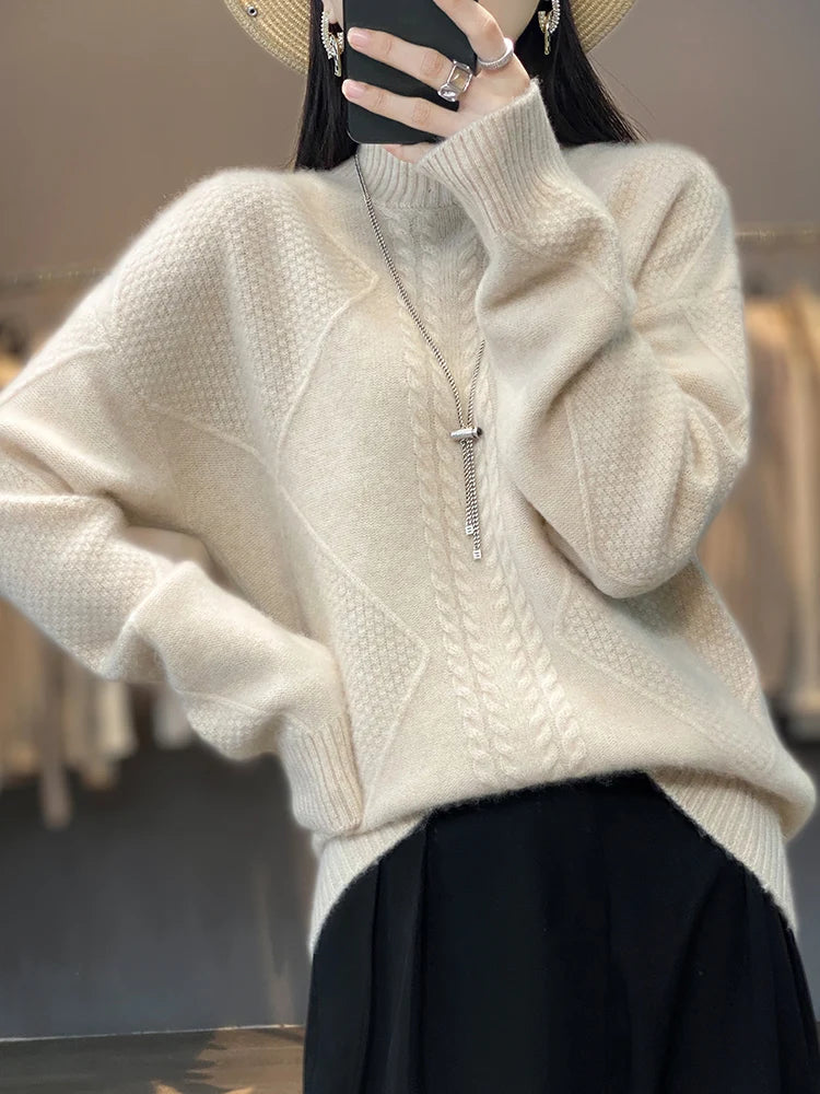 Person wearing a beige sweater with a blurred background