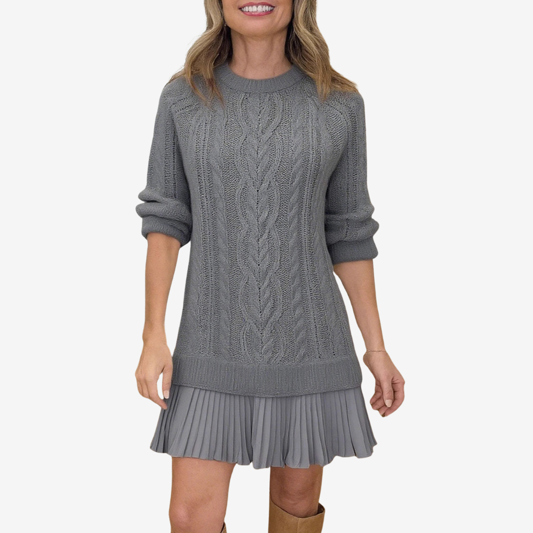 Woman wearing a gray cable knit dress on a white background