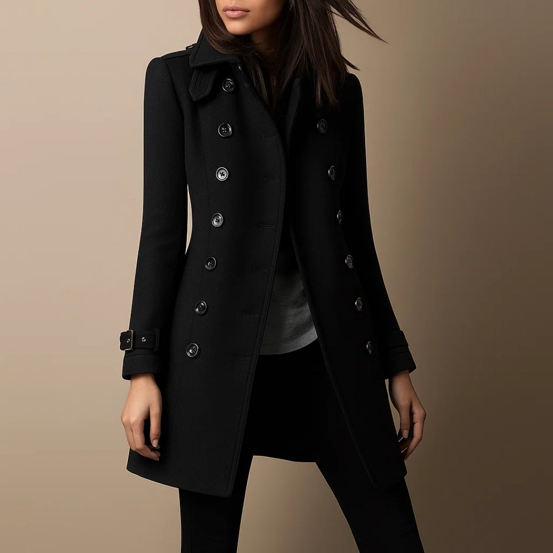 Black coat worn by a person on a beige background