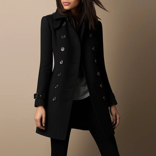 Black coat worn by a person on a beige background