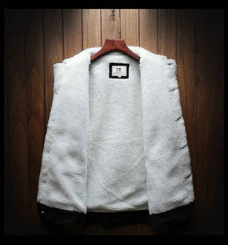 White fleece jacket on a wooden hanger against a wooden panel background