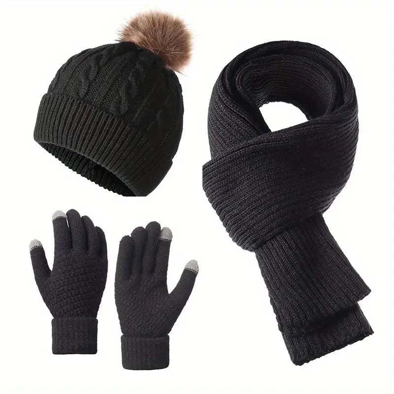 Black knit hat with pom-pom, scarf, and gloves set on a white background