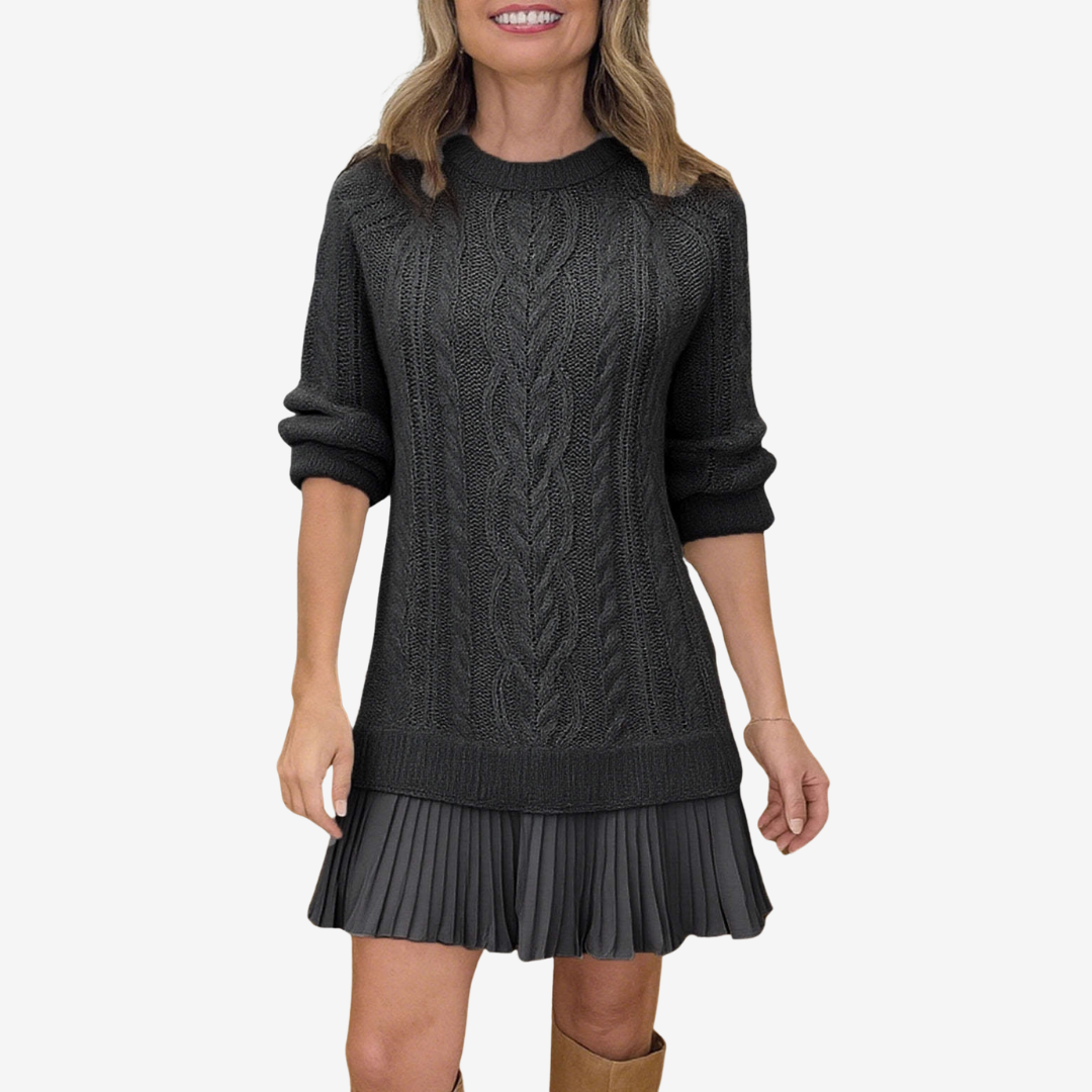 Woman wearing a dark gray cable knit dress on a white background